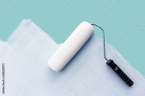 paint roller on an unpainted surface. Real estate renovation concept