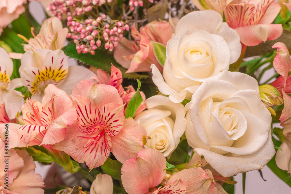 Bouquet of  soft pink flowers in wrapping paper.