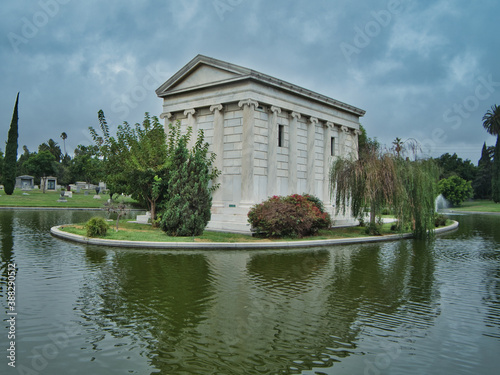 Crypt surrounded by trees and a lake © Alexey