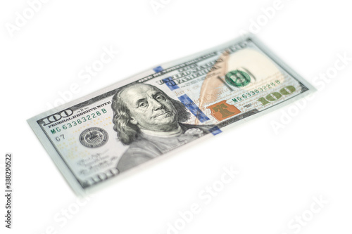 100 Dollars bill and portrait Benjamin Franklin on USA money banknote. Hundred dollar bills on white background..