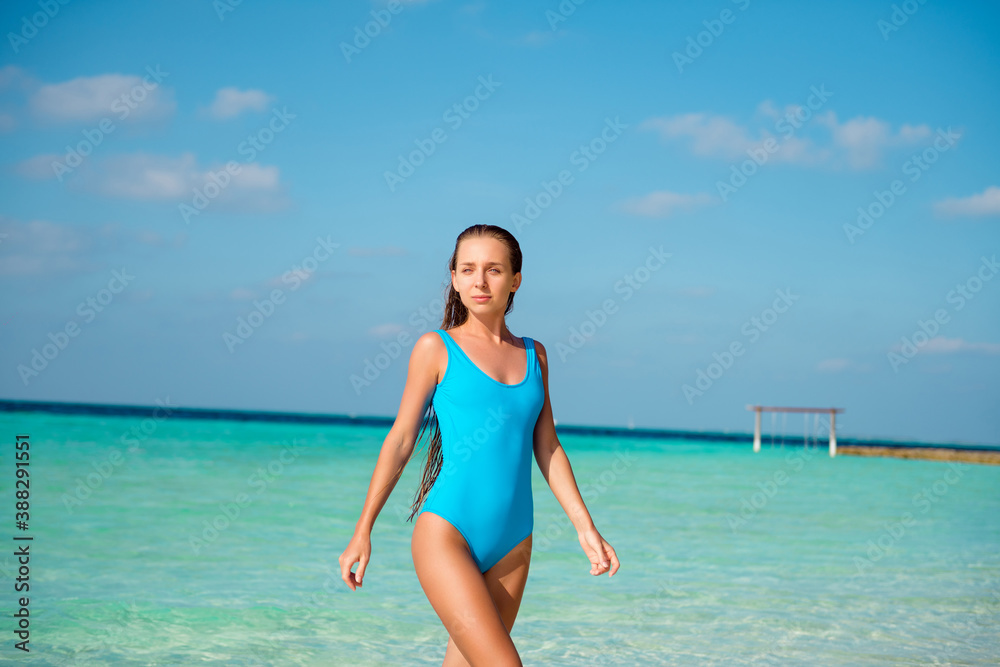Photo of pretty tender girl enjoy luxury weekend exotic resort swim hot water under blue sky walk go wear bodysuit