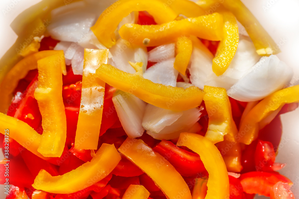 Onion and Pepper Cuts on Sliced Tomatoes