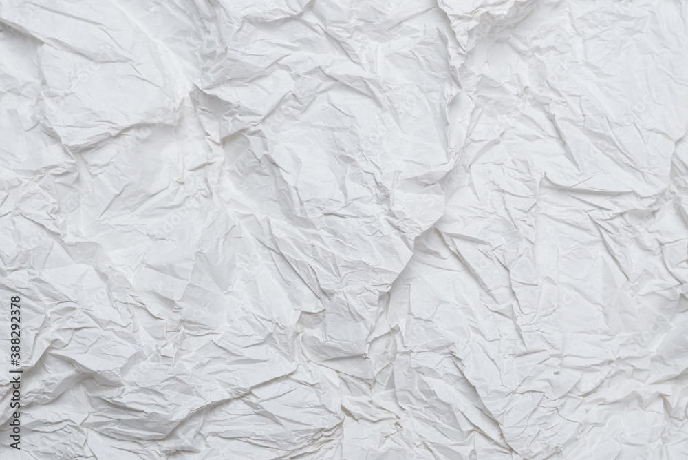 Naklejka premium Crumpled white paper background.