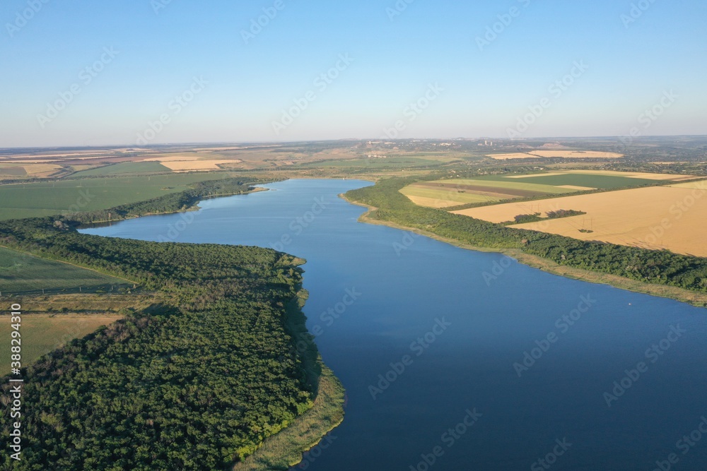 
blue lake in the rays of the setting sun