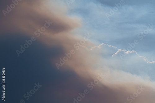 A smoke plume  obscures the sun as it advances across the sky