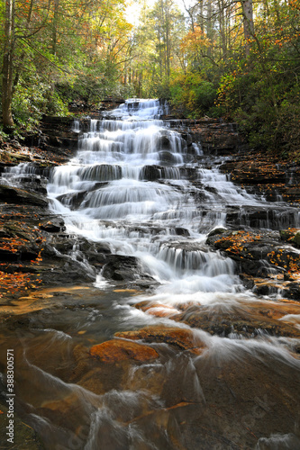 Fototapeta Naklejka Na Ścianę i Meble -  Minnehaha Falls is one of the most beautiful waterfalls in North Georgia.  It has a wonderful stairstep shape with a great natural flow.  The fall colors enhance its natural attraction.