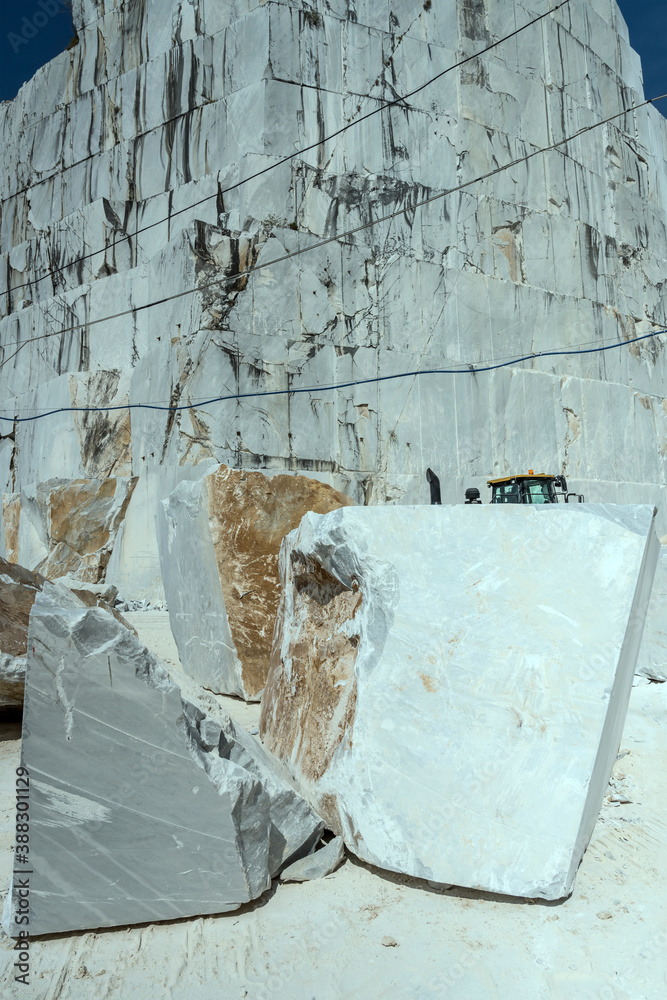 broken marble blocks under crag at quarry, Carrara, Italy