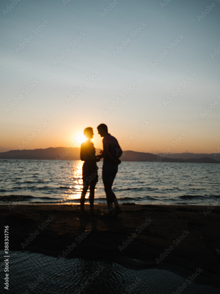 Couple silhouette sunset beach engagement Couple silhouette sunset beach engagement