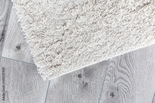 white home carpet on parquet floor