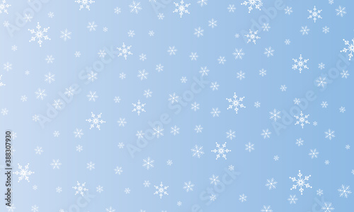 Snow background. Winter snowfall. White snowflakes on blue sky. Christmas background. Falling snow.