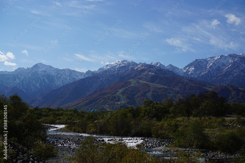 Autumn colorful foliage. mountains have 3 different colors made by nature, white, red, green. 