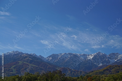 Autumn colorful foliage. mountains have 3 different colors made by nature, white, red, green. 