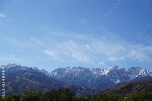 Autumn colorful foliage. mountains have 3 different colors made by nature, white, red, green. 