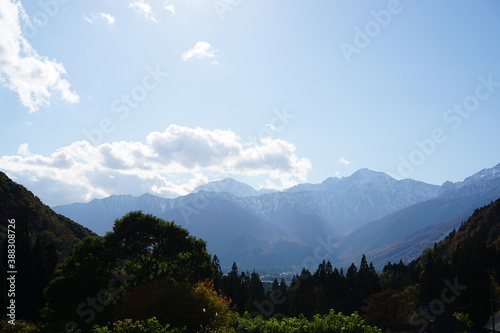 Autumn colorful foliage. mountains have 3 different colors made by nature, white, red, green. 