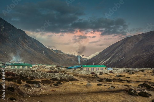 Houses of Dingboche village at sunset. Nepal Himalaya. Dingboche is a popular stop for trekkers and climbers headed to Mount Everest, Ama Dablam or Imja Tse for acclimatization purposes. photo