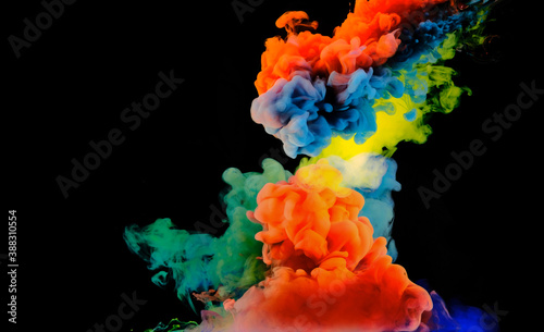 Color drops in water , abstract color mix , drop of Ink color mix paint falling on background,