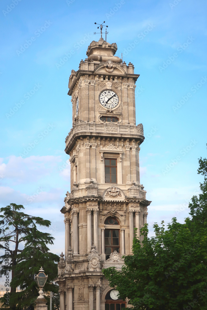 Clock Tower against blue sky. Dolmabahce Palace, Istanbul, Turkey