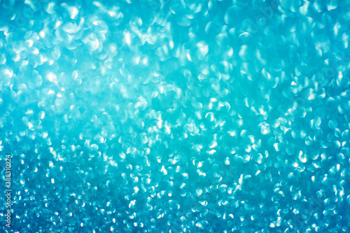 Blue glitter bokeh circle glow blurred and blur abstract. Glittering shimmer bright luxury . White and silver glisten twinkle for texture wallpaper and background backdrop. 