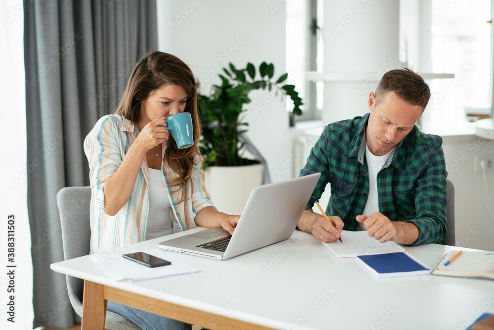 Husband and wife preparing bills to pay. Young couple having financial problems... Husband and wife preparing bills to pay. Young couple having financial problems...