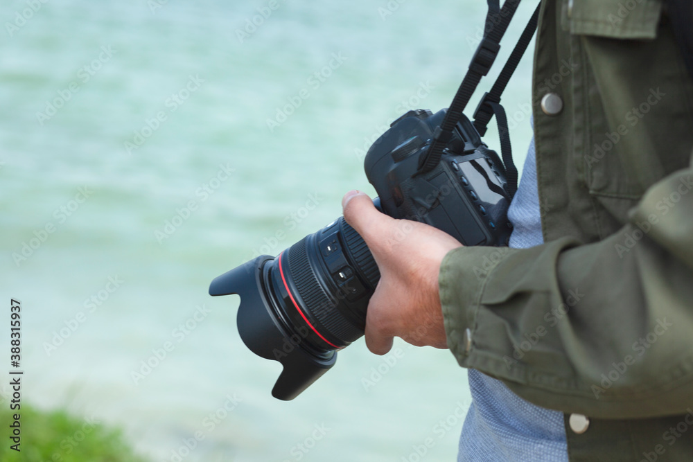 Fototapeta premium camera in the photographer hand