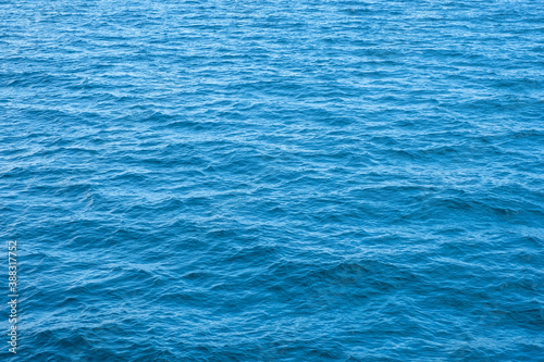 Surface of beautiful deep blue ocean background texture for background or backdrop..