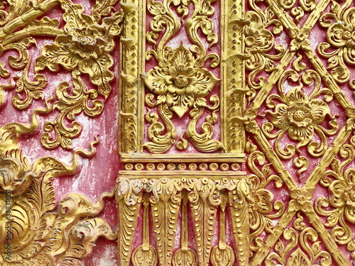 Traditional Thai style stucco on the wall of church in temple, Thailand.