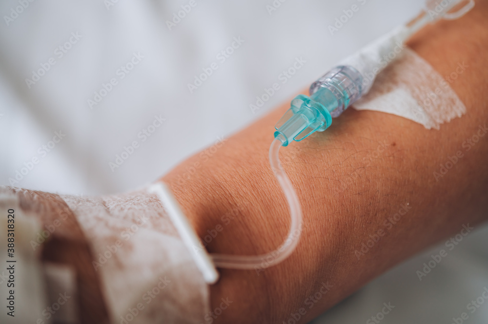 Patient's hand with Total Parenteral Nutrition (TPN) being administered