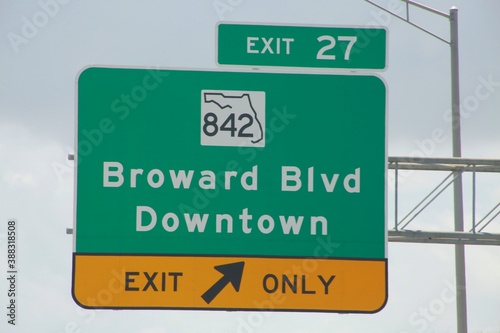 Exit 27 842 Broward Blvd Downtown Exit Only Sign Overhanging the Highway photo