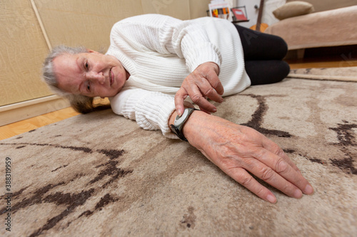 an old lady lies on the floor after a fall