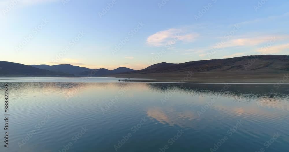 Aerial view of beautiful lake on sunset and fishing.Fisherman on lake. Fishermen Aerial view of beautiful lake on sunset and fishing.Fisherman on lake. Fishermen