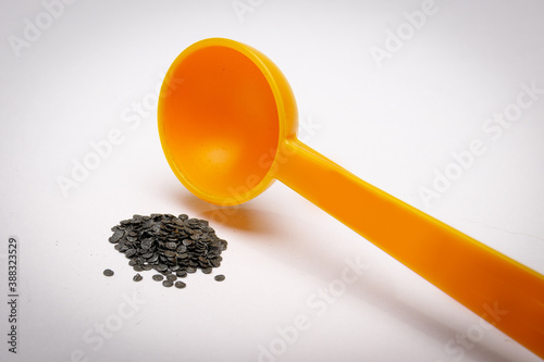 Reloading ammunition with gun powder using powder dipper measure.