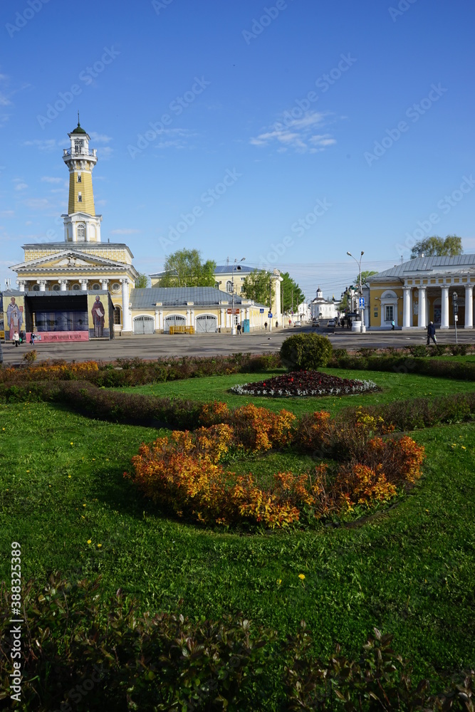 square in Kostroma with a flower bed and a view of the fire tower and guardhouse
