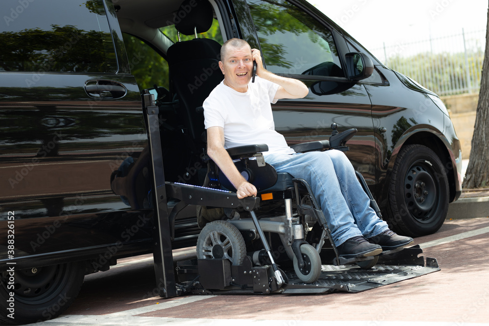 Disabled man on wheelchair lift