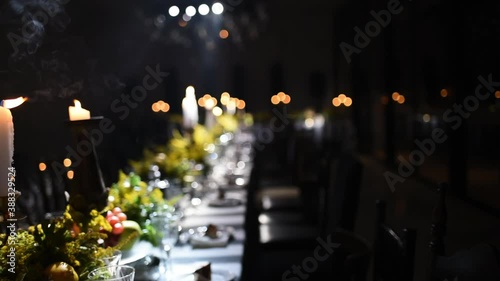 Romantic Wedding Table Ceremony Arragements, Candles on Dining Table, Light Show in Background, Pan Shot photo