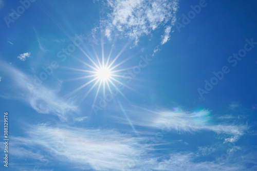 beautiful nature of blue sky with clouds and sun shines bright in the day
