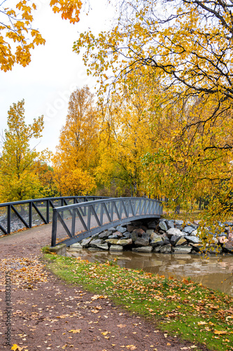 View of the small pedestrian bridge in autumn, Tervasaari Island, Helsinki, Finland