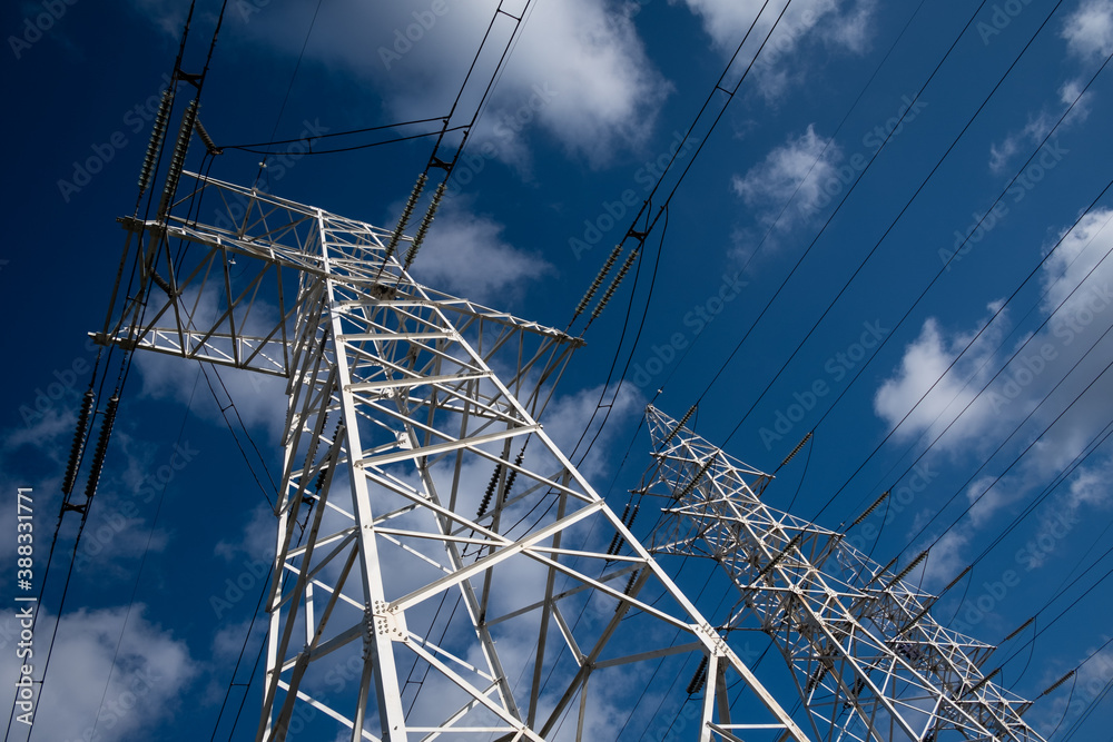 Power line tower on a background of blue sky with clouds. Power line tower on a background of blue sky with clouds.