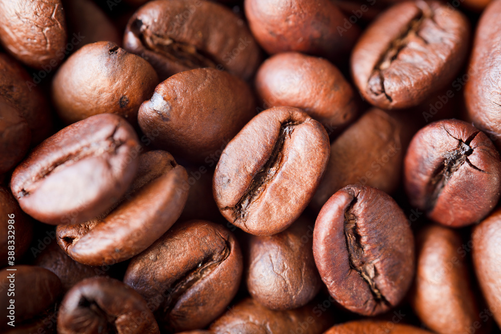 Fototapeta premium Roasted coffee beans background, Close up photo of coffee