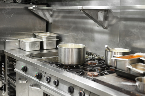 Stainless steel restaurant professional kitchen equipment and work surface. High quality photo