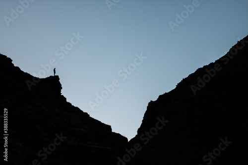 Winner silhouette on the mountain top. Sport and active life concept. switzerland