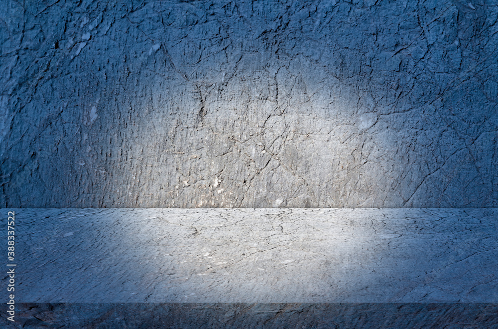 stone table studio background with blue spotlight. textured for product