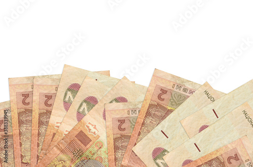 2 Ukrainian hryvnias bills lies on bottom side of screen isolated on white background with copy space. Background banner template photo