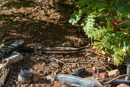 Pile of garbage on green grass in nature environmental problems. Nature disaster concept