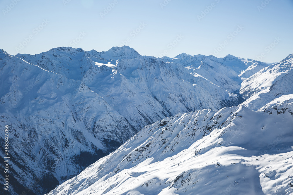 Blue sky and snowy mountains peak view. Panorama of winter Alps mountains in Solden,Tirol, Austria. copy space