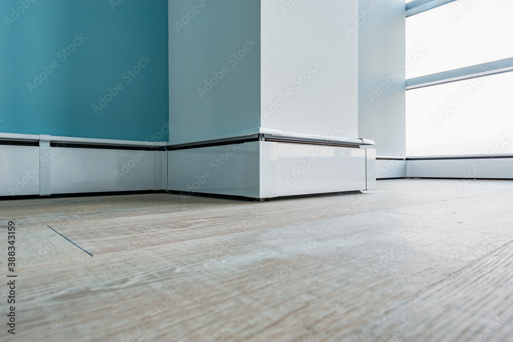 Fototapeta premium White plinth along the wall and floor.