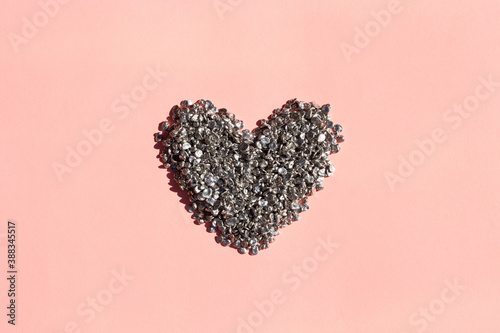 metal heart on a pink background