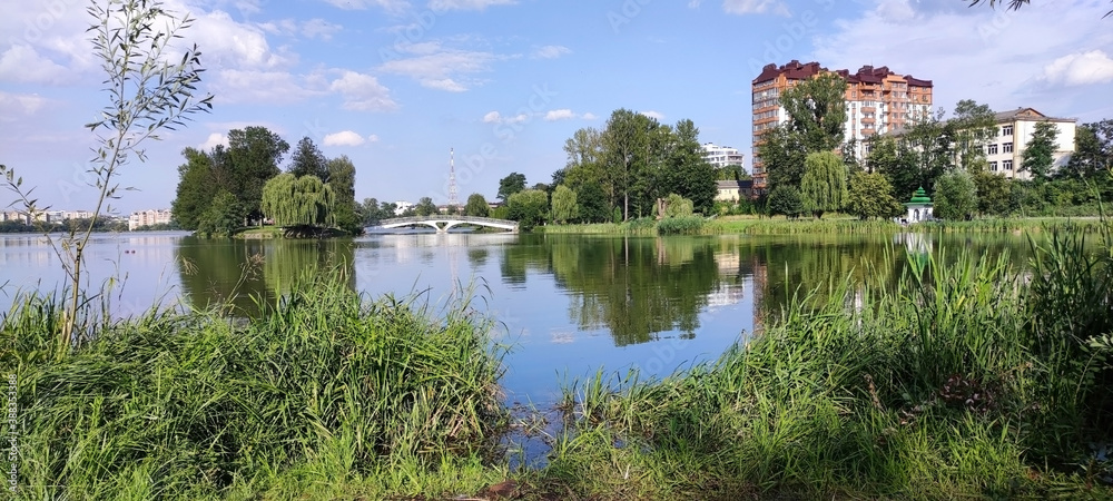 City lake in Ivano-Frankivsk. Reeds and Houses. Ukraine. Europe City lake in Ivano-Frankivsk. Reeds and Houses. Ukraine. Europe