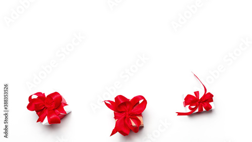 Valentine day composition: gift boxes with red bows on white background. with copy space. Top View.