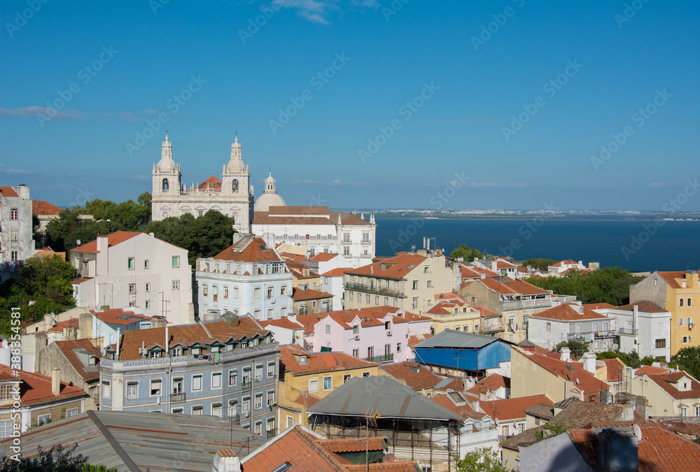Lisbon and Tagus River View of the streets and the orange roofs of the old town.