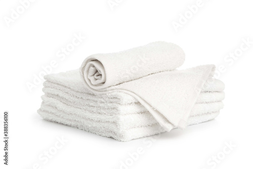 several white beach cotton towels folded on white background